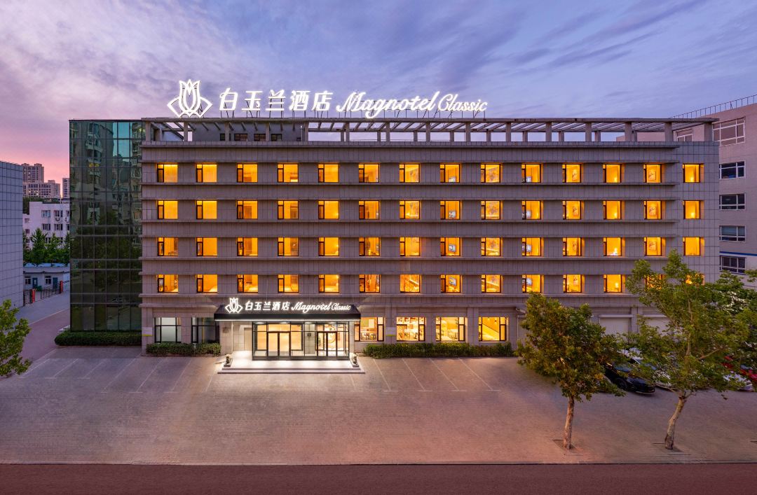 Magnolia Business Hotel ( Dalian Jinzhou Hengda Garden）