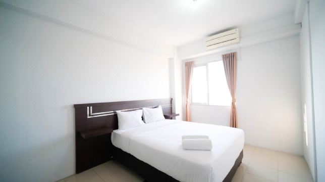 Simple 2BR with Extra Bed at Menara Rungkut Apartment By Travelio