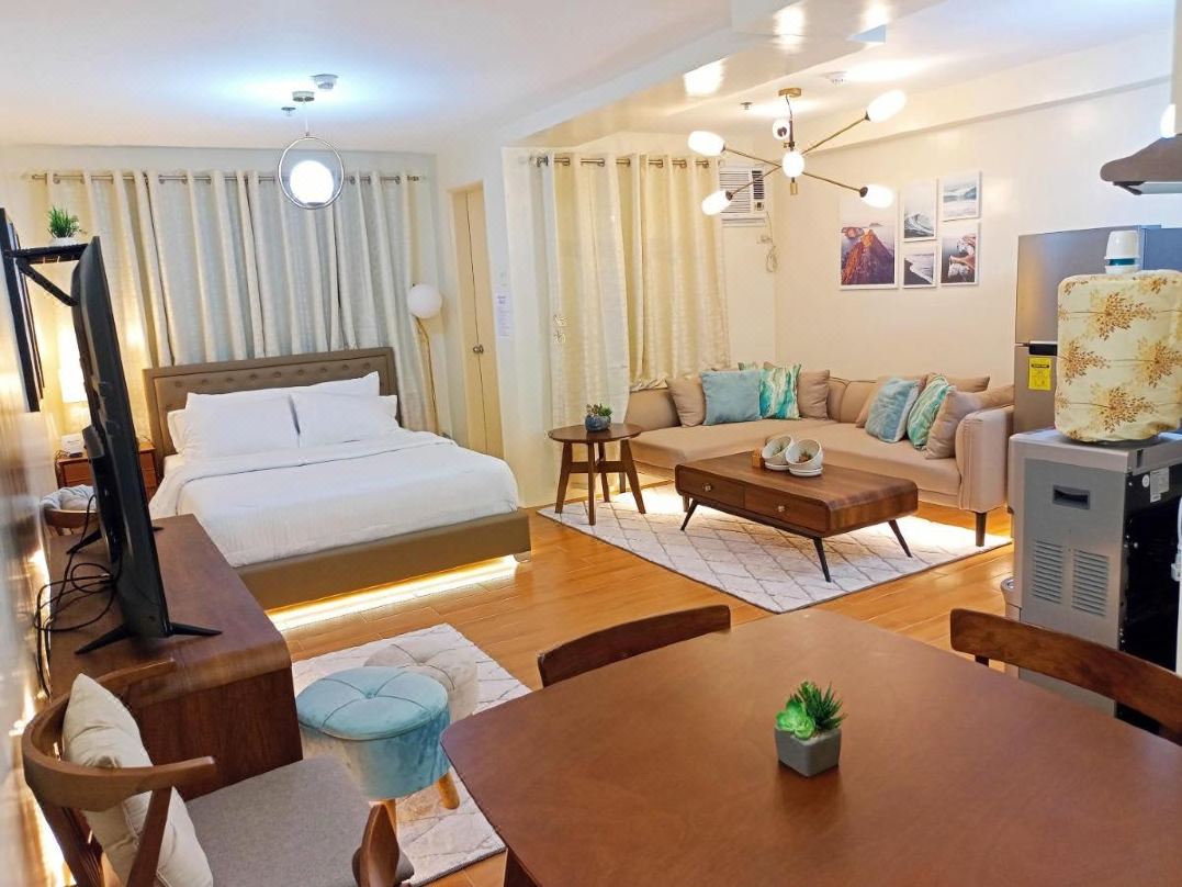 Spacious 36Sqm Studio with 65 TV Netflix Karaoke and Pool Access Near Airport and Samal Ferry