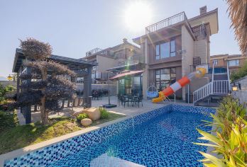 清远熹乐谷6房10床温泉泳池别墅+泡池+KTV+烧烤+麻将【别墅内带真温泉泡池入户+泳池+KTV+烧烤+麻将+滑梯，配套设施齐全】