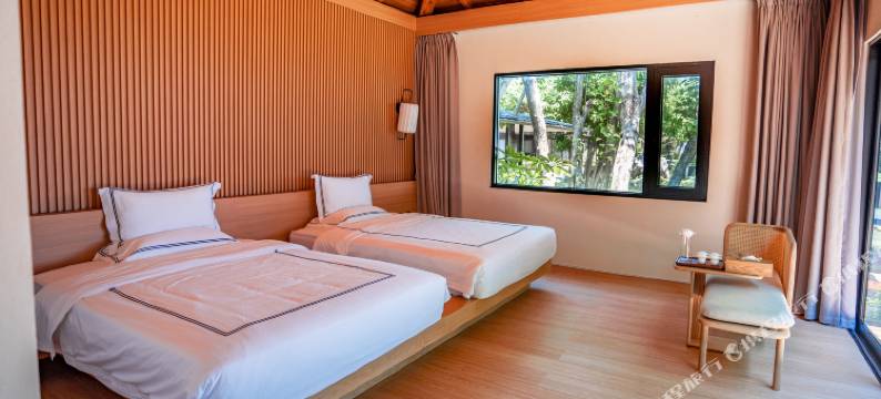 三亚蜈支洲岛珊瑚酒店木屋图片