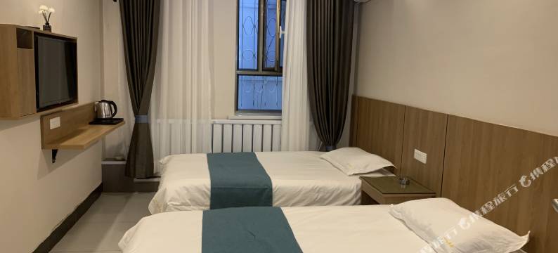 酒泉红丹丹小宾馆(酒泉鼓楼汉唐美食街店)图片