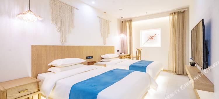 桃花源酒店(米东吾悦广场贡米巷店)图片