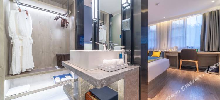 丽橙酒店·智(宜昌三峡大学CBD购物中心智能店)图片