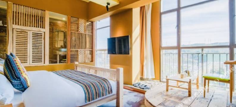 昆明原始部落高颜值酒店(呈贡大学城高铁南站店)图片