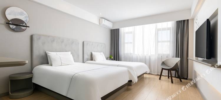 白玉兰酒店(琼海万泉河环球春天广场店)图片