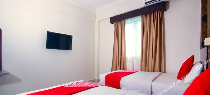 Hotel O 翁布伊民宿靠近哈吉伊鲁斯的坎丹甘粽子店(OYO 93512 Umbuy Homestay NearKetupat Kandangan Haji Irus)图片