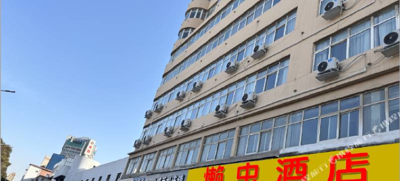 懒虫酒店(许昌曹魏古城胖东来生活广场店)图片