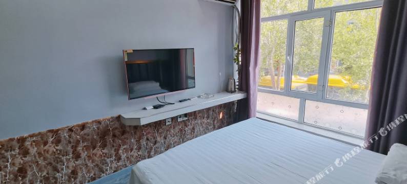 哈尔滨爱浓新概念旅馆(东北农业大学店)图片