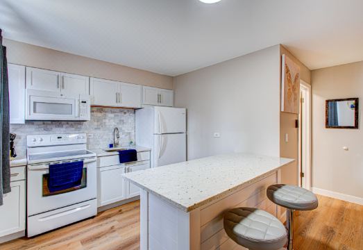 Full Kitchen and Cozy Living Area - Stunning Getaway Hotel Overview