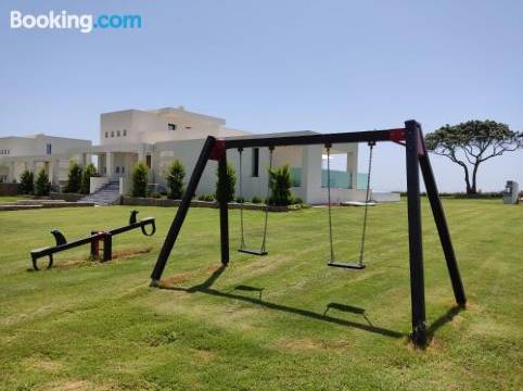 Seafront Villa Nafsika - Private Heated Infinity Pool - Direct Access to the Beach - Play Area