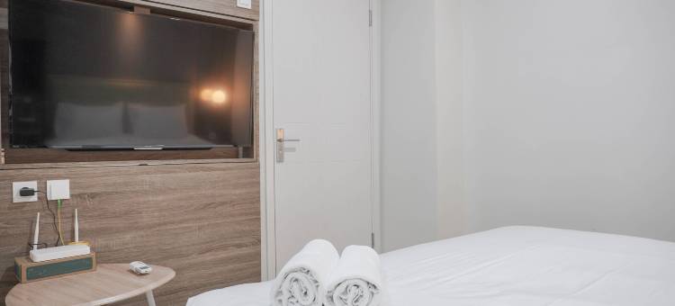 在Daan Mogot市公寓的漂亮和新1Br与办公室房间(Nice and New 1Br with Office Room at Daan Mogot City Apartment)图片