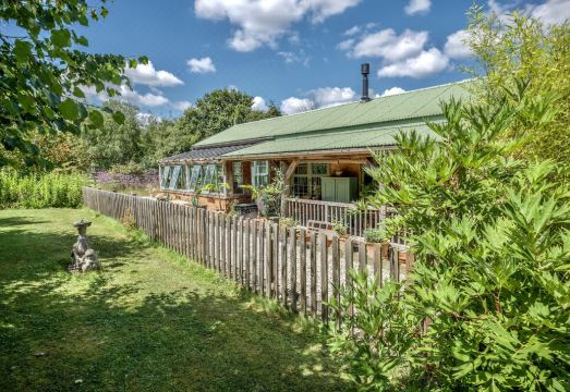 The Garden Room. Timber framed, light and airy accommodation with veranda.