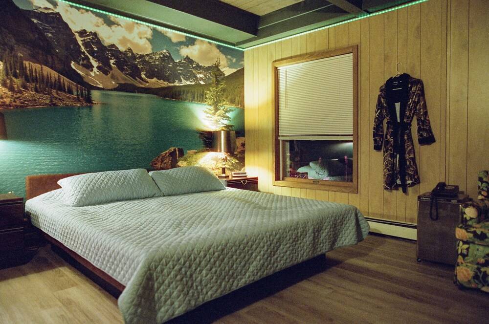 Vintage kitsch 70s/80s themed house with indoor pool and backyard creek