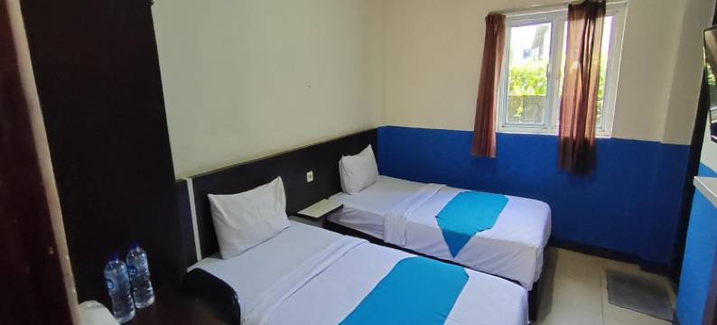 Hotel O 翁布伊民宿靠近哈吉伊鲁斯的坎丹甘粽子店(OYO 93512 Umbuy Homestay NearKetupat Kandangan Haji Irus)图片