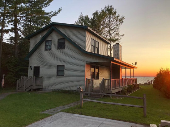 Black Lake sunset waterfront home 78' private sandy beach on prestine Black Lake