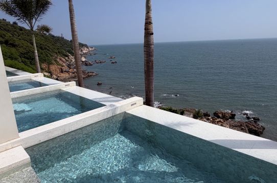 Yuhai Resort Hotel exterior and pool area on Nan'ao Island cliff