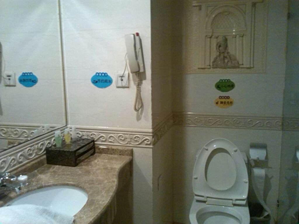 嘻牛·温州大酒店(贵阳喷水池地铁站店)-客卧