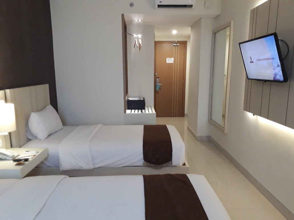 棉兰牙也马达瑞士贝尔旅店主图