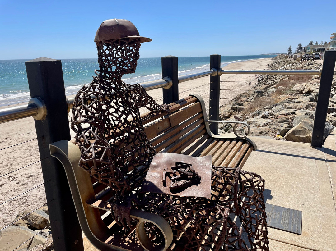 Person Sitting On A Bench