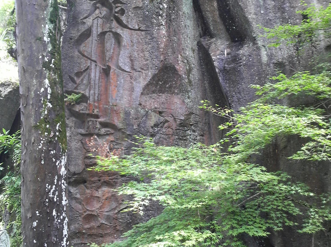 Curved Sanskrit Characters Group on the Polished Cliff in Aoki-玉名市必去景点
