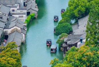 嘉兴乌镇东栅+西栅含夜景一日游【纯玩5A双水乡/专车上门接】【懒人游，晚出发，打消早起的烦恼，晚上看完古镇夜景返程。】