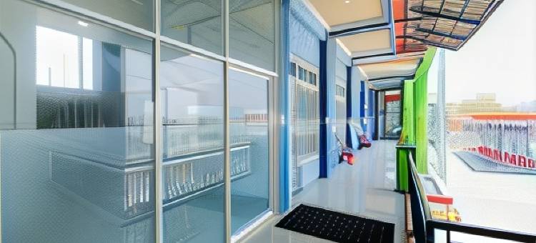 格兰德肯卡纳沙里亚旅馆尼尔威萨塔巴哈里拉蒙甘-红门酒店Mitra(Grand Kencana Guesthouse Syariah Near Wisata Bahari Lamongan)图片