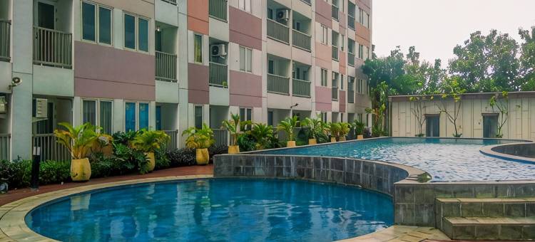 Gray Accent 1BR at Grand Sentraland Karawang Apartment By Travelio图片