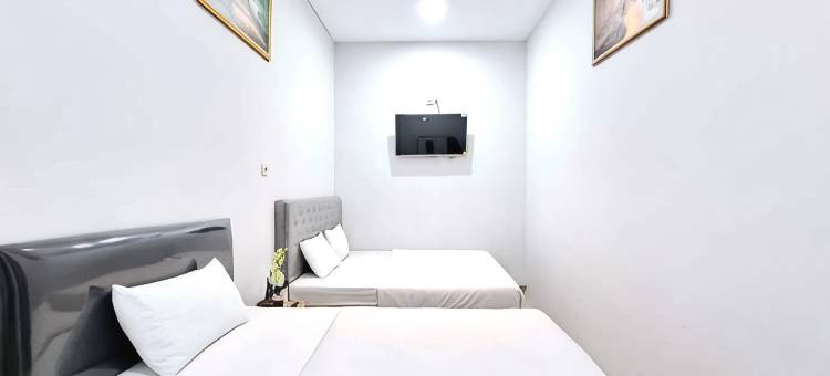 卡里斯玛努山塔拉萨甘米特拉红门酒店(Kharisma Nusantara Homestay Sagan Mitra RedDoorz)图片