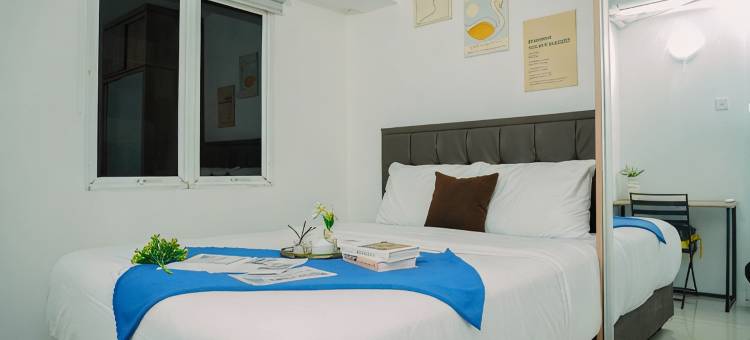 Gray Accent 1BR at Grand Sentraland Karawang Apartment By Travelio图片