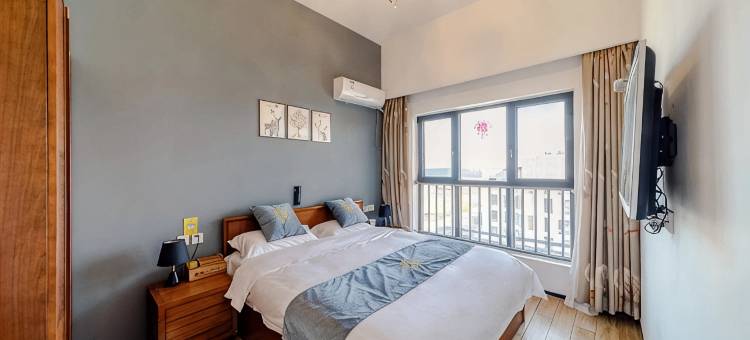 怀瑾握瑜蔚蓝海岸顶层观海洋房民宿(华贸一路1号分店)图片