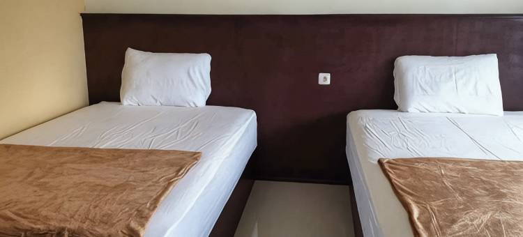 庞越市布罗莫22米特拉巴尤昂加车站伊斯兰教法红多兹民宿(Bromo 22 Homestay Syariah Near Terminal Bayuangga Probolinggo Mitra RedDoorz)图片