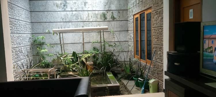 西阿里亚蜂蜜宾馆的舒适房间(Comfy Room at Honey Guesthouse Syariah)图片
