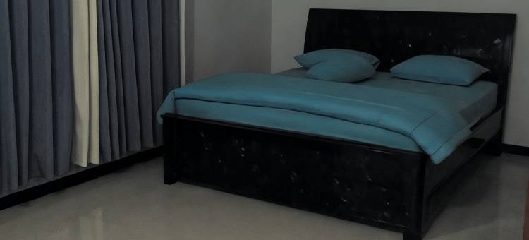 西阿里亚蜂蜜宾馆的舒适房间(Comfy Room at Honey Guesthouse Syariah)图片