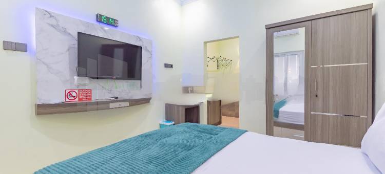 希瓦家园沙利亚红伙伴靠近阿伦阿伦特加尔(Shiva Home Syariah RedPartner Near Alun Alun Tegal)图片