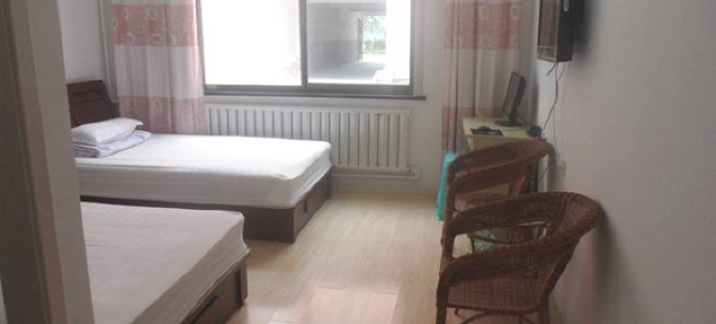 青岛家暖宾馆图片