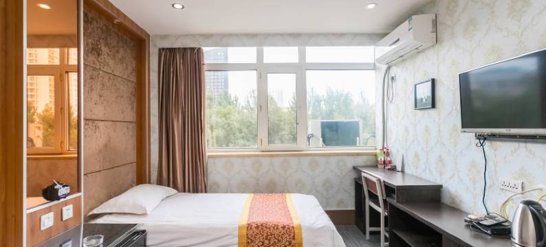 金芒果快捷宾馆(哈尔滨学府凯德广场师大夜市店)图片