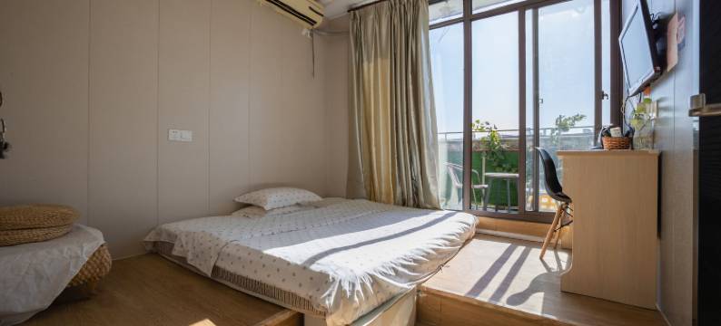 苏州圆石小歇主题宾馆(苏州科技大学石湖校区店)图片