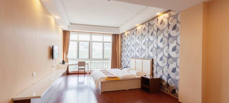 万华晟居宾馆(蓬莱新汽车站店)图片