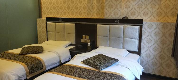 新龙梁昂孜荣大酒店图片