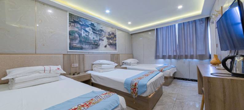 苏州起点假日宾馆(本色美术馆尹中路地铁站店)图片