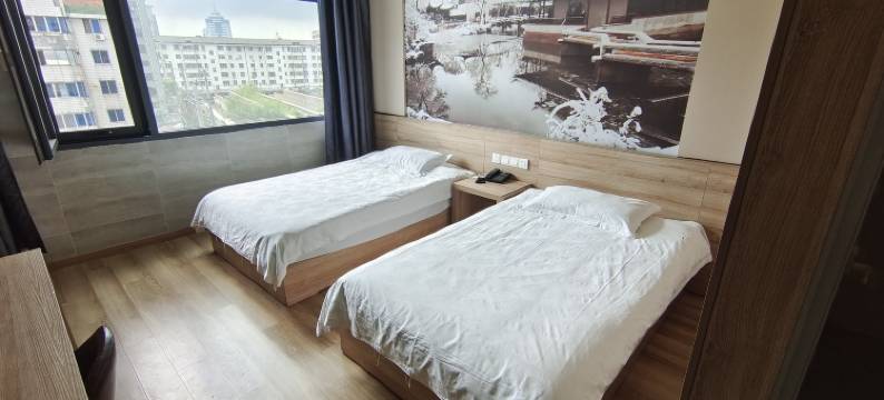 全淇轻居酒店(丹阳火车站眼镜城店)图片