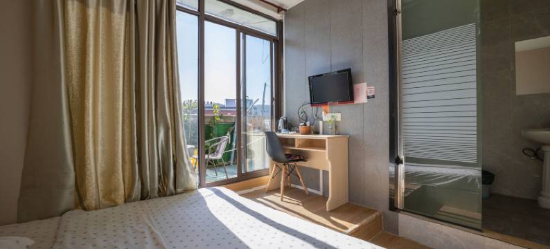 苏州圆石小歇主题宾馆(苏州科技大学石湖校区店)图片