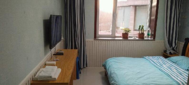 大连七彩阳光电影主题家庭旅馆图片