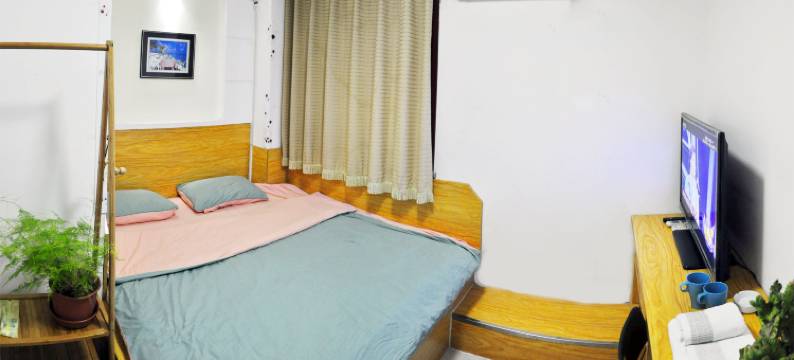 大连七彩阳光电影主题家庭旅馆图片