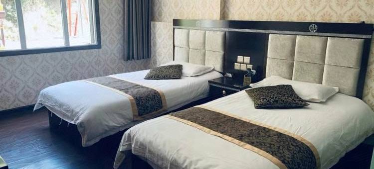 新龙梁昂孜荣大酒店图片