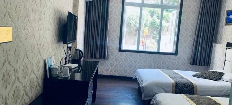 新龙梁昂孜荣大酒店图片