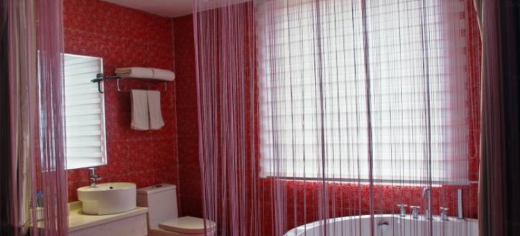 信阳爱琴海主题酒店(浉河中学店)图片