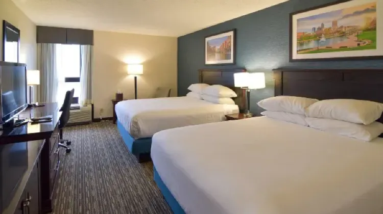 Cozy hotel room with two beds, table and chairs at Best Western Plus Indianapolis North at Pyramids