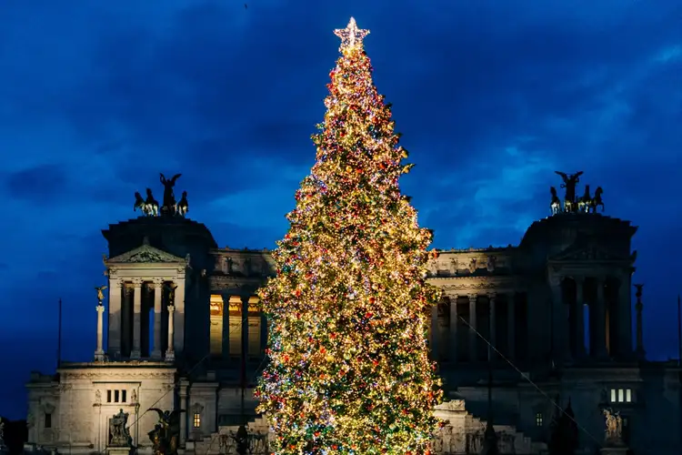 Source: Gabriella Clare Marino/ unsplash A magnificent Christmas tree at the Piazza Venezia in Rome, Italy